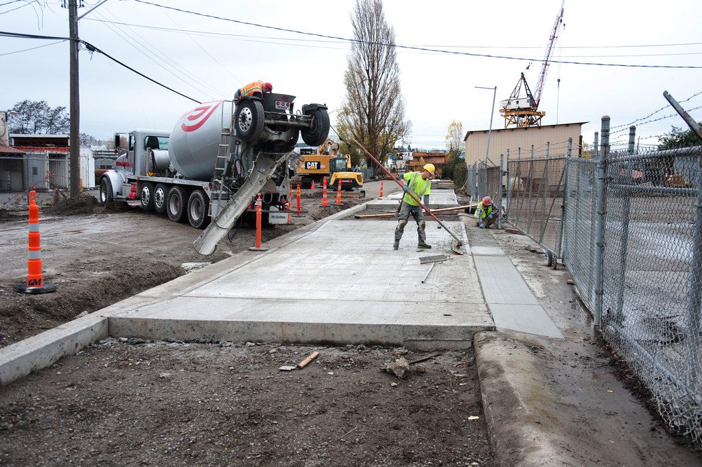 Crews pour concrete driveways