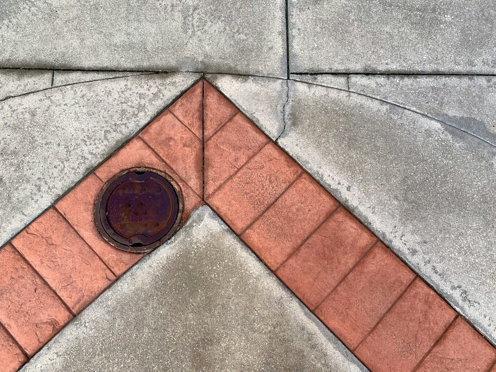Sidewalk with a manhole cover